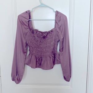 Long sleeve crop top. Tight fitted around torso.